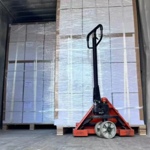 Heavy cargo pallets reinforced with polyester composite straps inside a shipping container