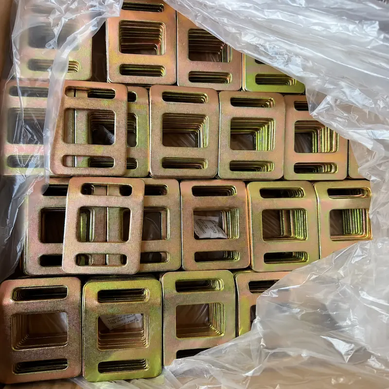 Bulk supply of flat stamped metal lashing buckles with zinc plated finish for woven lashing and cargo securing applications