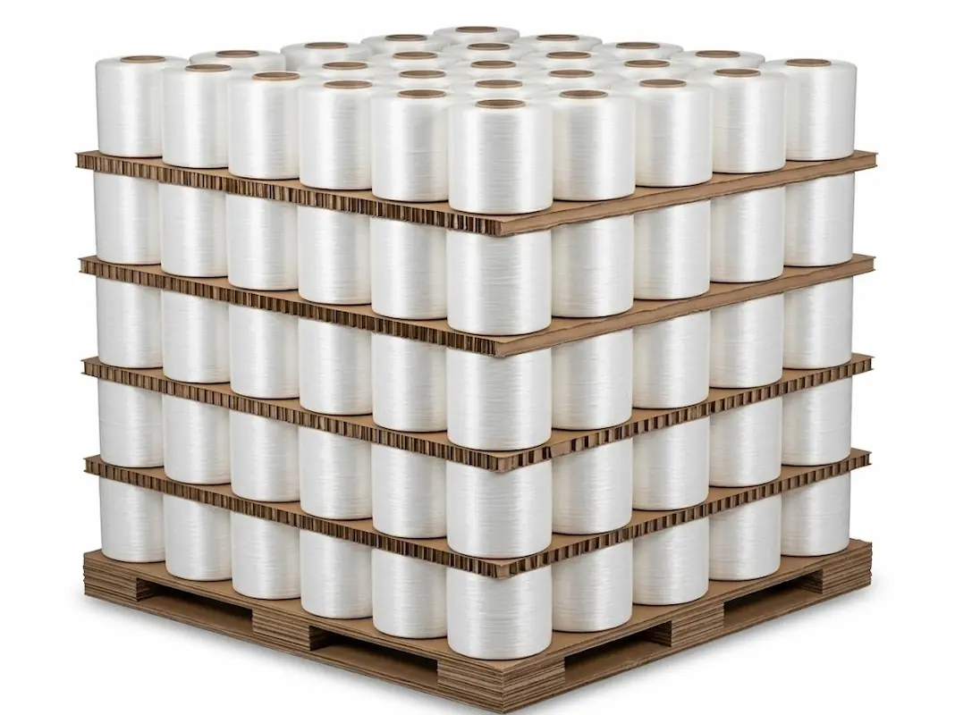 Palletized hot melt polyester strapping rolls stacked on wooden pallet for shipping