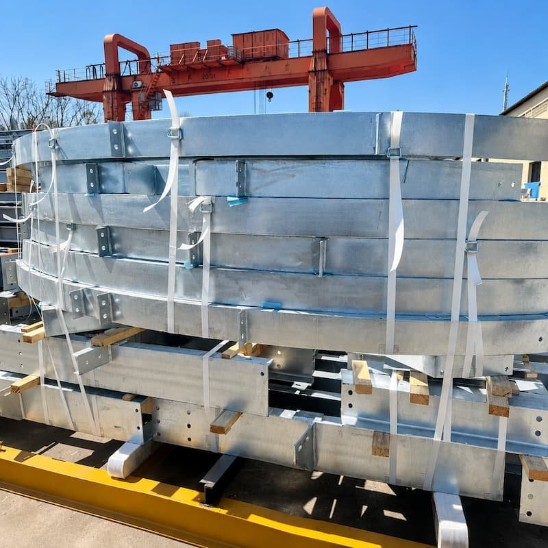 Composite strapping securing heavy metal products and steel bundles